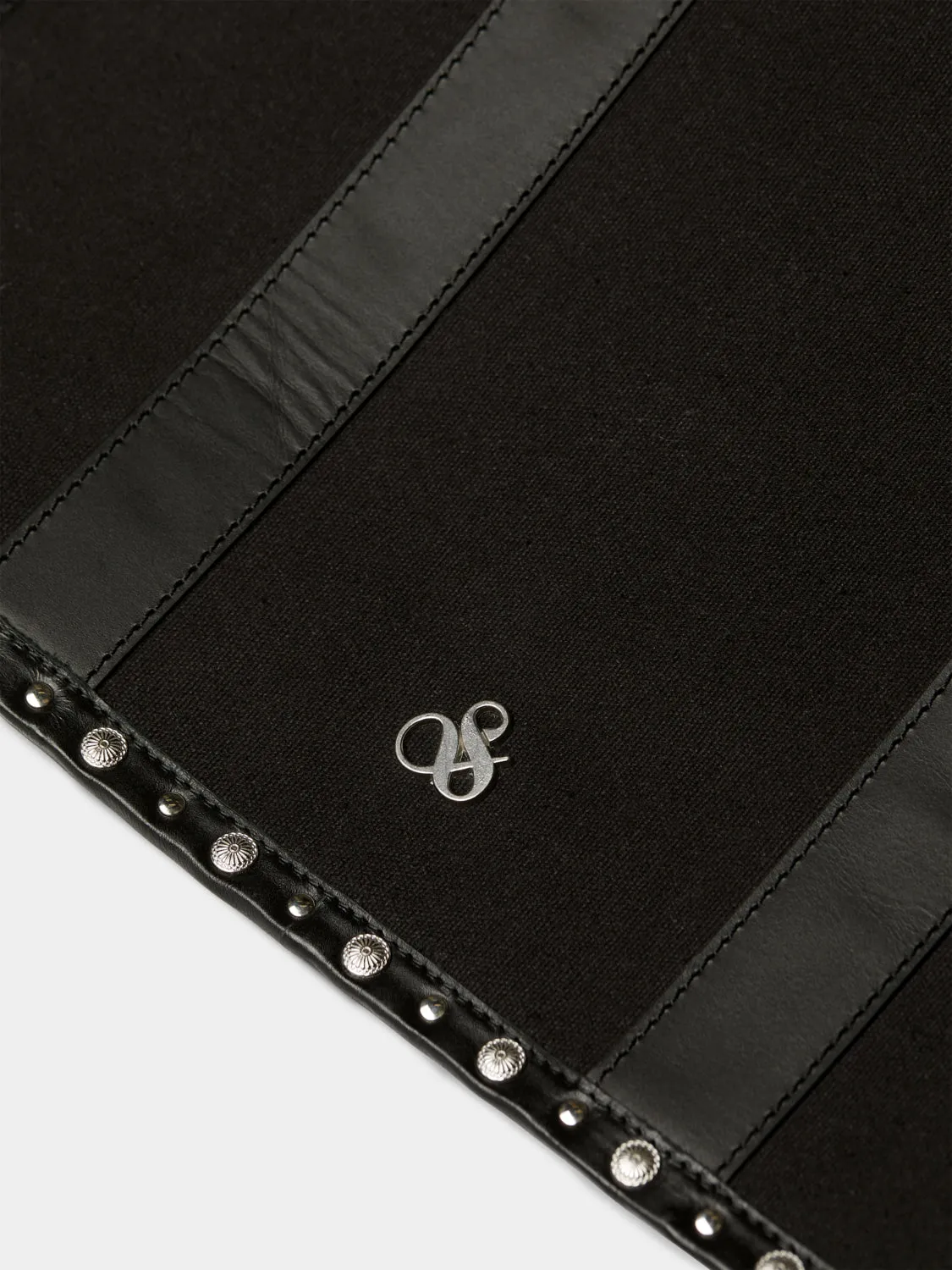 Canvas shopper with studs and leather trimming