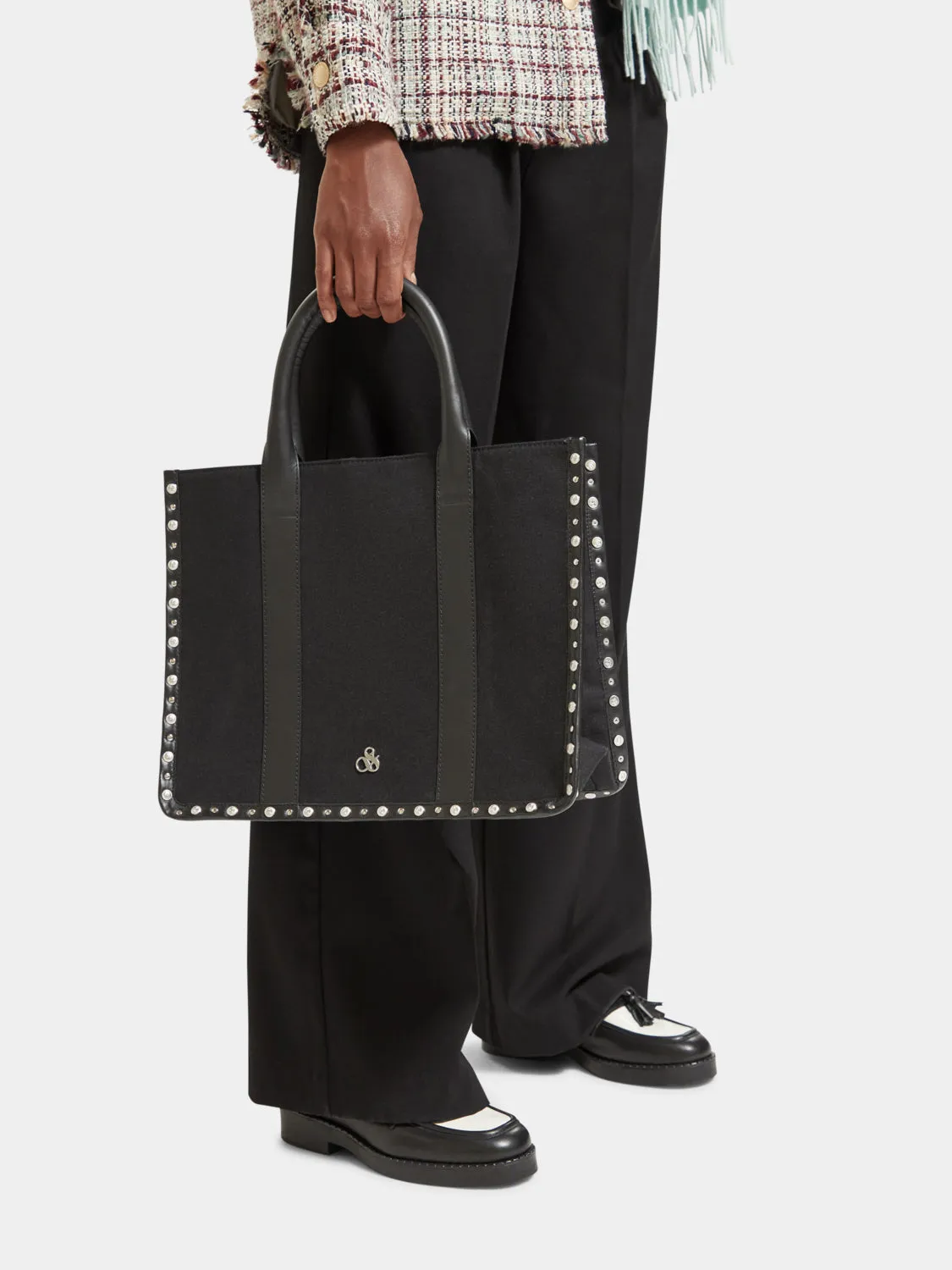 Canvas shopper with studs and leather trimming